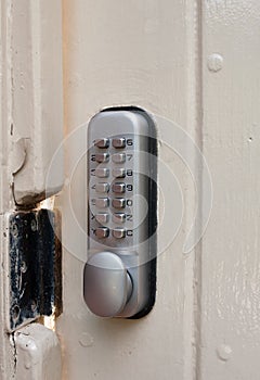 Close up of door lock metal code numbers protection