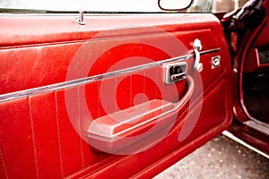 Close-up of the door panel of an old powerful classic American car