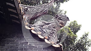 Close up of a dragon lion sculpture  decorate on a roof of an old chinese tradition architecture in Shawan ancient town Guangzhou