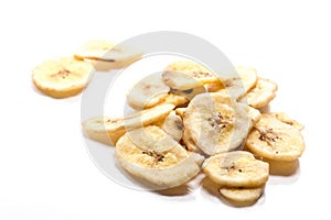 Dried banana slices on white background