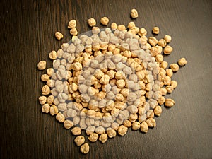 Close up of dried cheakpea beans Cicer arietinum on wooden background
