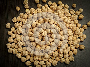 Close up of dried cheakpea beans Cicer arietinum on wooden background