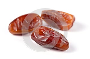 Close up of dried date palm fruit  isolated on white