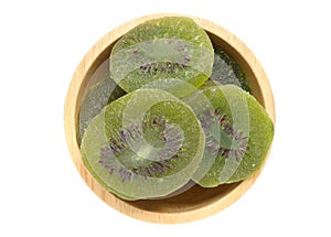 Close up of Dried dried kiwi fruit isolated on white background. Sweet and sour dried kiwi in a wooden bowl.