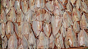 Close-up dried fish on bamboo background
