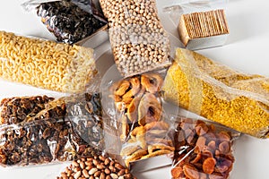 close up of dried fruits, cereals, pasta and nuts