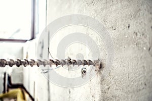 close-up of drilling machinery on construction site. handyman using a jackhammer drilling machine to make holes