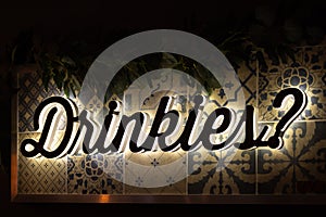 Close up of Drinkies sign, light up at dark sign photo