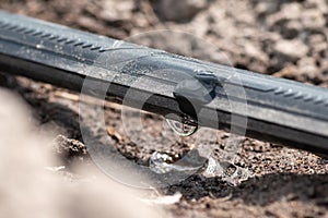 Close up of drip irrigation on a field, macro shot