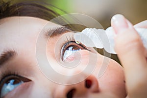 Close up drips into eye cataract medication.