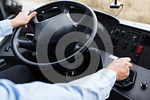 Close up of driver driving passenger bus