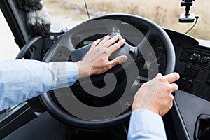 Close up of driver driving passenger bus