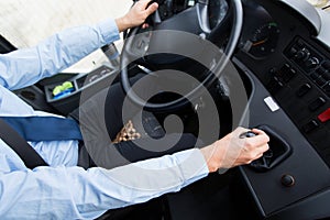 Close up of driver driving passenger bus