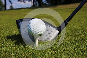 Close up of driver and golf ball.