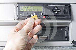 Close up of a driver holding a fuse. Speed limiter disabled by pulling a fuse out. Transportation concept