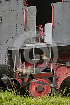 Close up of a drivers cabine and wheels of an old steam funicular in Austria.