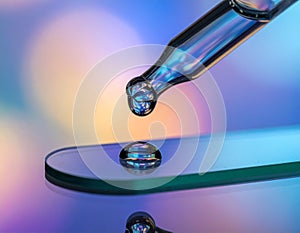 Close-up of Droplet Falling onto Surface with Reflection