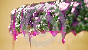 Close-up of drops of pink epoxy.