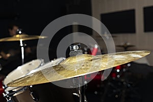Close up of drum cymbal. Gold metal detail of drumkit