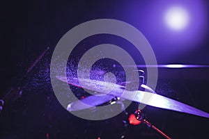 Close up of drum set in illuminated nightclub