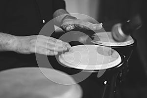 close up of a drummer's hands playing a hand drum