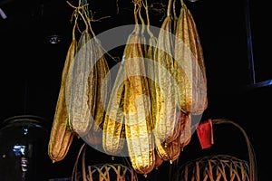 Close-up of dry old loofah sacs for washing dishes in a pan