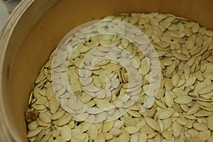 Close up of dry pumpkin seeds in the bowl.