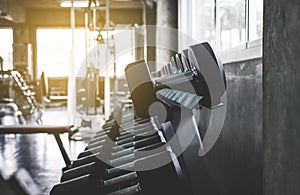 Close up of dumbbell set at the gym,Equipment weight training on rack in sport club