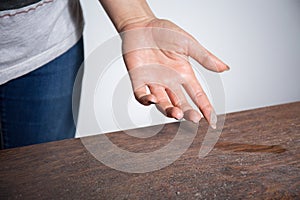 Close-up of dust on woman finger