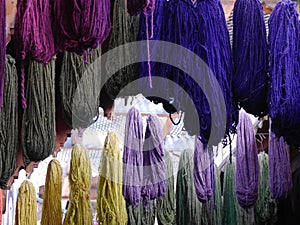Close up of dyed yarn hanging and drying in medina, Fez, Morocco