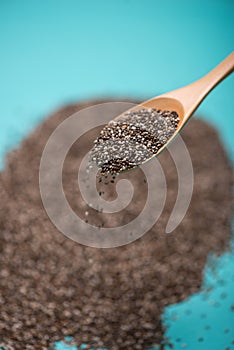 Close-up of ealthy chia seeds in a spoon. Text space.