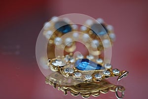 Close-up of earrings in a jewelry display case