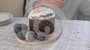 Close-up of Easter cake and painted eggs at the morning table