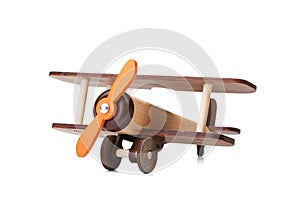 Close-up of an eco-friendly product for children`s games, isolated on a white background. A developing toy airplane.