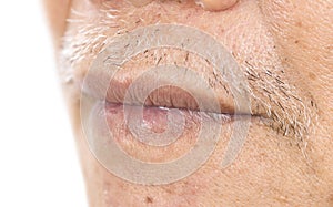 Close-up of elderly asian man mouth with wrinkle on face