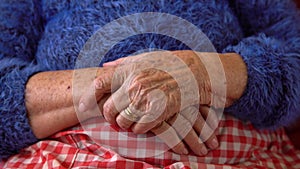 Close up elderly hands of a widowed old woman. Caucasian 90s grandma sitting