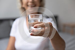 Close up of elderly woman recommend water drinking