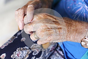 Close up of elderly womans hands and wedding ring