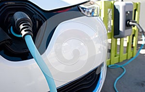 Electric car being charged photo