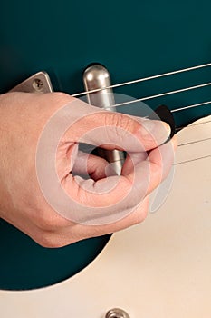 Close up of an electric guitar being played