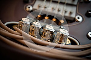 close-up of electric guitar strings, with the hum and twang of the instrument audible