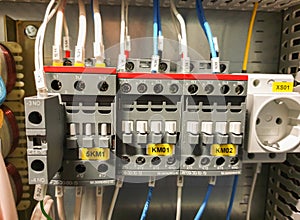 close-up of an electrical cabinet with controls and automation. Electrical contactor, electrical wires. Industrial electrical pane photo