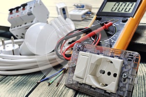 Close-up of electrical components and equipment on aged wooden background