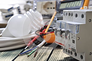 Close-up of electrical components and equipment on aged wooden background