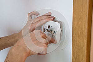 Close-up of for electrical hands who installing electrical light switch.