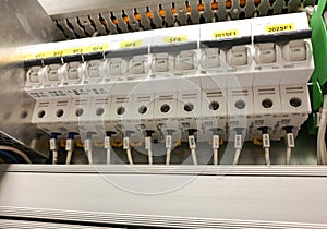 Close-up of electrical panel with circuit breakers on, electrical cabinet, industrial electrical installation. selective focus,