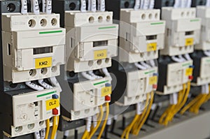 Close-up electrical wiring with fuses and contactors.