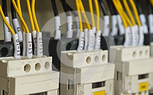 Close-up electrical wiring with fuses and contactors.
