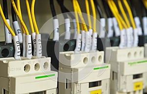 Close-up electrical wiring with fuses and contactors.