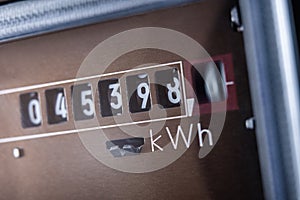 Close up of electricity meter with rotating digit